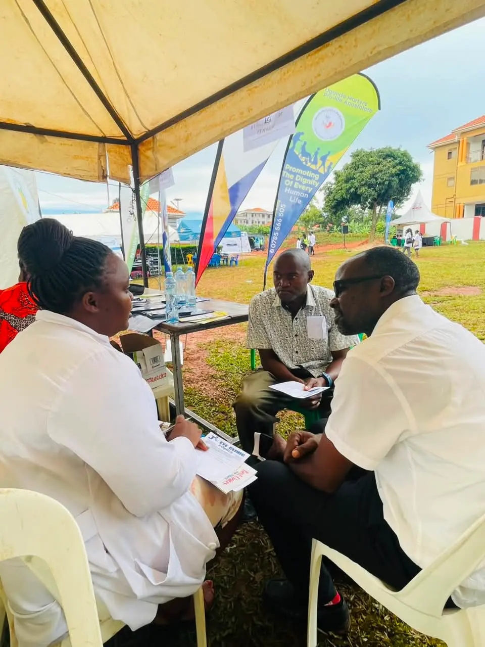 A one-to-one screening at an outreach tent